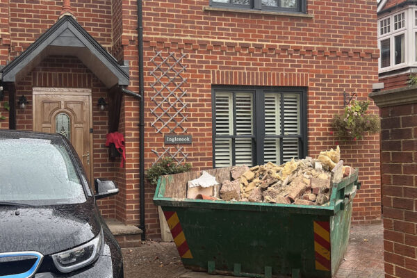 Skip filled with building materials and ready for collection